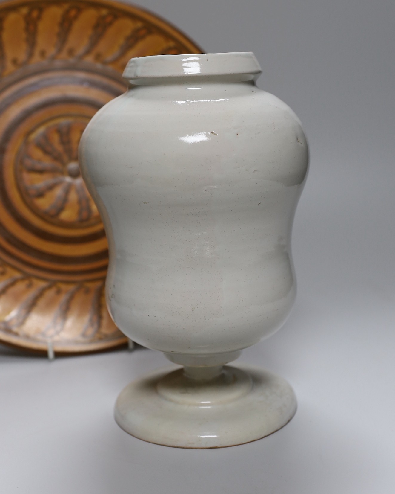 A large Doulton wall plate, model no. D6061 - 34cm diameter and a Dutch Delft drug jar - 26cm tall